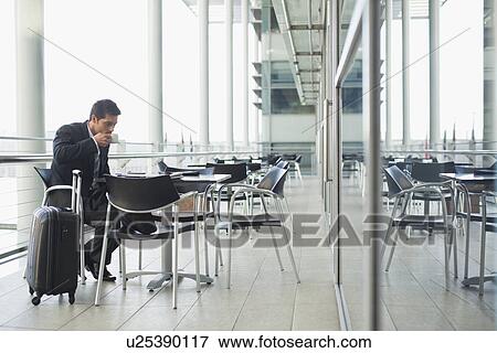 Businessman drinking coffee in cafe View Large Photo Image Stock Photo - Businessman drinking coffee in cafe. Fotosearch