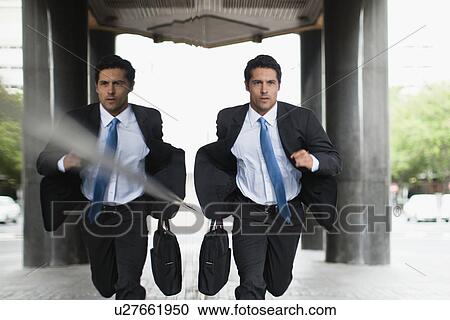 Businessman running on city street View Large Photo Image Stock Image - Businessman running on city street. Fotosearch