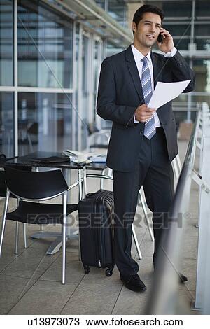 Businessman talking on cell phone View Large Photo Image Stock Image - Businessman talking on cell phone. Fotosearch