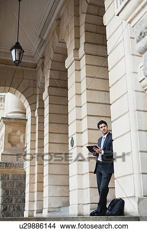Picture - Businessman using tablet computer. Fotosearch