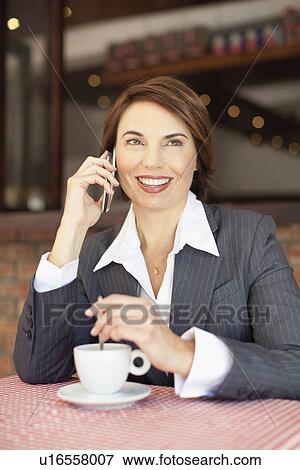 Businesswoman having coffee in cafe View Large Photo Image Stock Photo - Businesswoman having coffee in cafe. Fotosearch