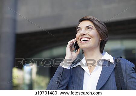 Businesswoman talking on cell phone View Large Photo Image Stock Image - Businesswoman talking on cell phone. Fotosearch