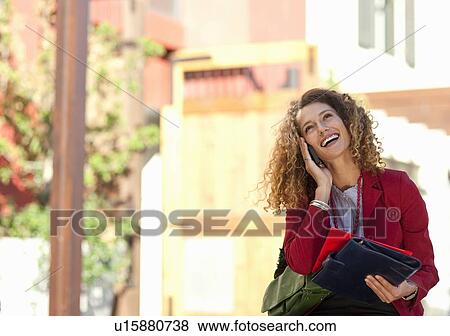 Businesswoman talking on cell phone View Large Photo Image Stock Photo - Businesswoman talking on cell phone. Fotosearch