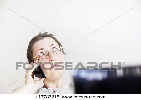 Stock Photography - Businesswoman talking on cell phone. Fotosearch