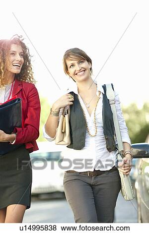 Businesswomen walking together View Large Photo Image Stock Photo - Businesswomen walking together. Fotosearch