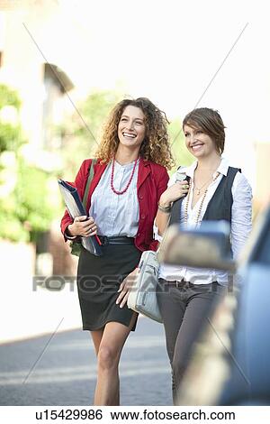 Businesswomen walking together View Large Photo Image Stock Photograph - Businesswomen walking together. Fotosearch