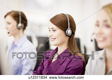 Businesswomen working in headsets View Large Photo Image Picture - Businesswomen working in headsets. Fotosearch