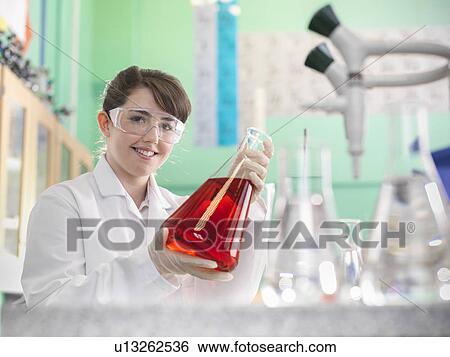 Chemistry student working in lab View Large Photo Image Stock Photograph - Chemistry student working in lab. Fotosearch