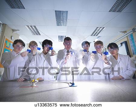 Chemistry teacher and students in lab View Large Photo Image Stock Photography - Chemistry teacher and students in lab. Fotosearch