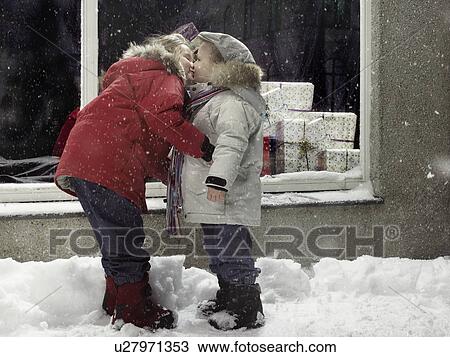 Children kissing in snow View Large Photo Image Stock Image - Children kissing in snow. Fotosearch
