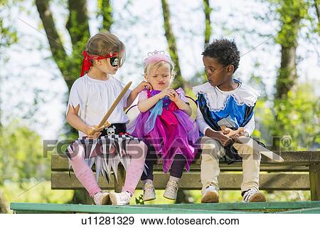 Children playing dress up outdoors View Large Photo Image Stock Photo - Children playing dress up outdoors. Fotosearch