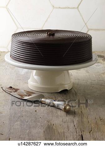 Chocolate cake on serving tray View Large Photo Image Stock Photo - Chocolate cake on serving tray. Fotosearch