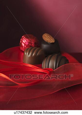 Chocolates on decorative box View Large Photo Image Stock Image - Chocolates on decorative box. Fotosearch