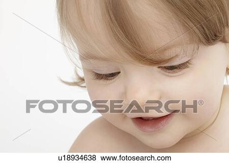 Close up of baby girls face View Large Photo Image Stock Photo - Close up of baby girls face. Fotosearch