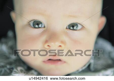 Stock Photograph - Close up of babys eyes. Fotosearch