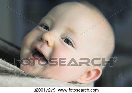 Close up of babys laughing face View Large Photo Image Stock Photo - Close up of babys laughing face. Fotosearch
