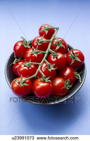 Close up of bowl of cherry tomatoes View Large Photo Image Stock Image - Close up of bowl of cherry tomatoes. Fotosearch