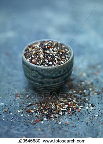 Stock Image - Close up of bowl of seeds. Fotosearch