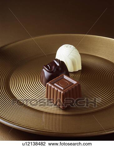 Close up of chocolates on serving tray View Large Photo Image Stock Image - Close up of chocolates on serving tray. Fotosearch