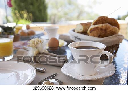 Close up of coffee at breakfast table View Large Photo Image Stock Photo - Close up of coffee at breakfast table. Fotosearch