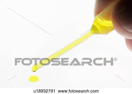 Close up of dropper of liquid View Large Photo Image Stock Image - Close up of dropper of liquid. Fotosearch