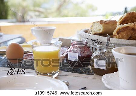 Stock Photography - Close up of food at breakfast table. Fotosearch