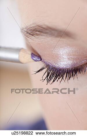 Close up of girl applying makeup View Large Photo Image Stock Image - Close up of girl applying makeup. Fotosearch