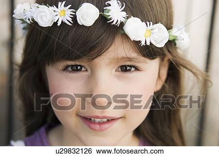 Close up of girl wearing flower crown View Large Photo Image Stock Photograph - Close up of girl wearing flower crown. Fotosearch