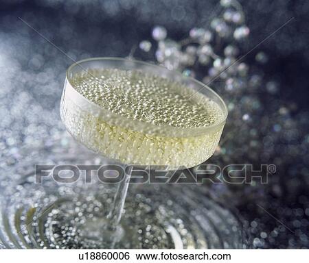 Close up of glass of champagne View Large Photo Image Stock Photograph - Close up of glass of champagne. Fotosearch