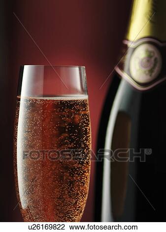 Stock Image - Close up of glass of sparkling wine. Fotosearch