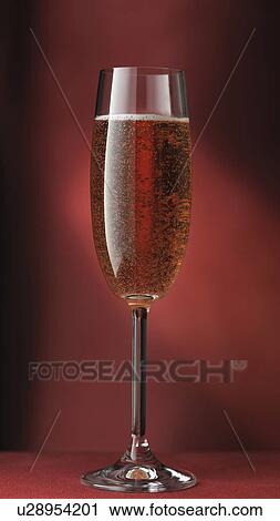 Stock Image - Close up of glass of sparkling wine. Fotosearch