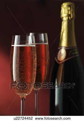 Stock Image - Close up of glasses of sparkling wine. Fotosearch