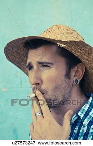 Close up of man smoking cigarette View Large Photo Image Stock Photo - Close up of man smoking cigarette. Fotosearch