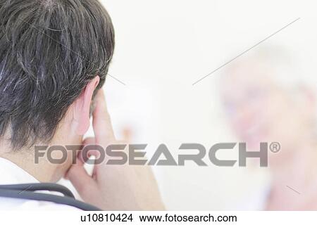 Close up of mans ear and finger View Large Photo Image Picture - Close up of mans ear and finger. Fotosearch
