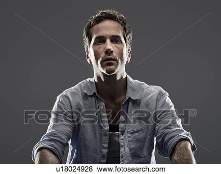 Close up of mans serious face View Large Photo Image Stock Photo - Close up of mans serious face. Fotosearch