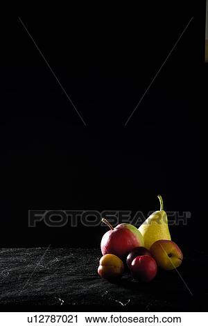 Stock Image - Close up of pile of fruit. Fotosearch