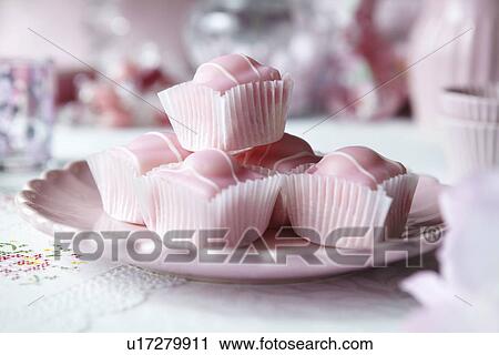 Stock Image - Close up of plate of candies. Fotosearch