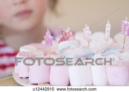 Stock Image - Close up of plate of decorated candies. Fotosearch