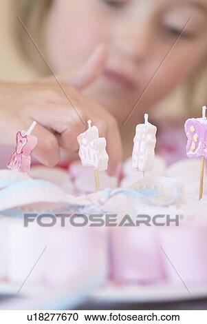 Stock Image - Close up of plate of decorated candies. Fotosearch