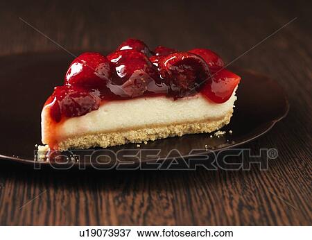 Stock Photo - Close up of plate of fruit cheesecake. Fotosearch