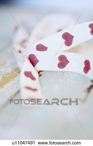 Close up of ribbon with hearts on it View Large Photo Image Stock Image - Close up of ribbon with hearts on it. Fotosearch