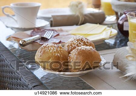 Close up of rolls at breakfast table View Large Photo Image Stock Photograph - Close up of rolls at breakfast table. Fotosearch