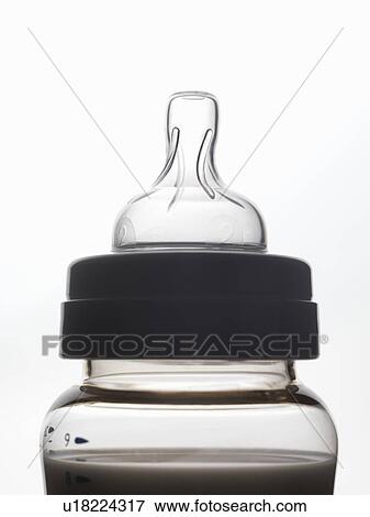 Close up of silhouette of baby bottle View Large Photo Image Stock Photo - Close up of silhouette of baby bottle. Fotosearch