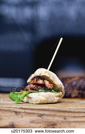 Stock Image - Close up of skewered rump steak burger. Fotosearch