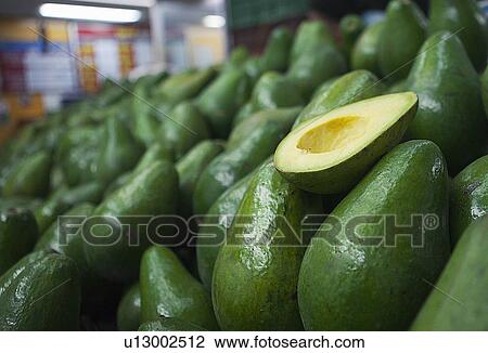 Close up of sliced avocado for sale View Large Photo Image Stock Image - Close up of sliced avocado for sale. Fotosearch