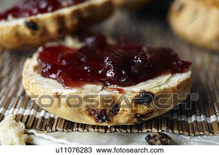 Close up of sliced scone with jam View Large Photo Image Stock Image - Close up of sliced scone with jam. Fotosearch