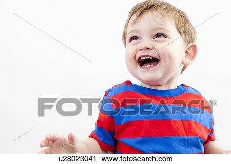 Stock Image - Close up of toddler boy laughing. Fotosearch