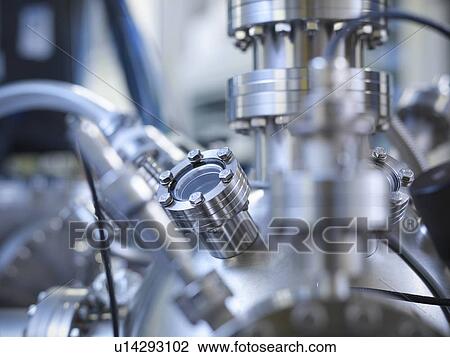 Stock Image - Close up of vacuum chamber in lab. Fotosearch