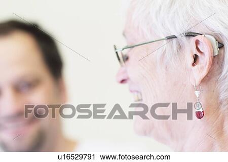 Close up of womans hearing aid View Large Photo Image Stock Image - Close up of womans hearing aid. Fotosearch