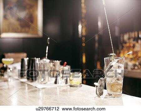 Stock Image - Cocktail making tools on bar. Fotosearch